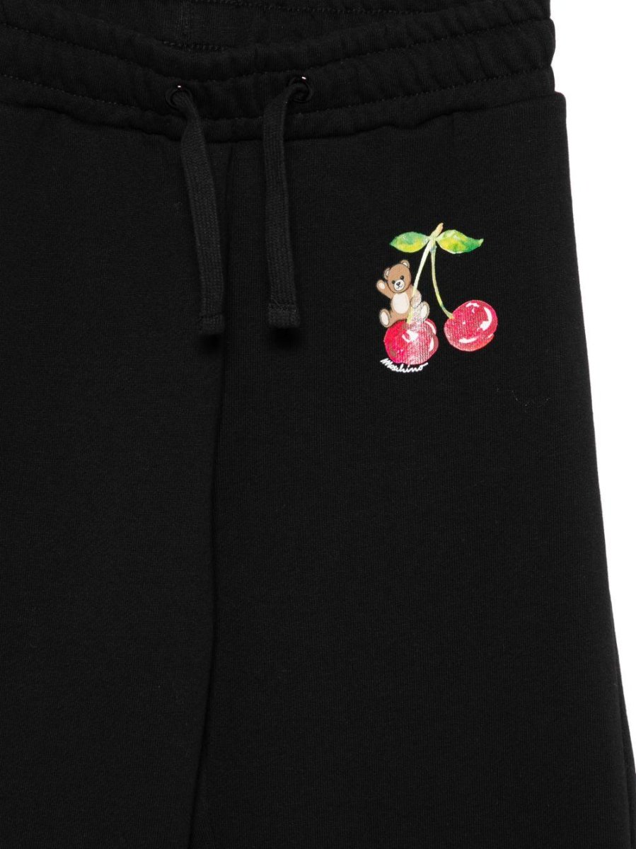Tuta per bambina Moschino Kids nera con stampa grafica sul petto - immagine 3